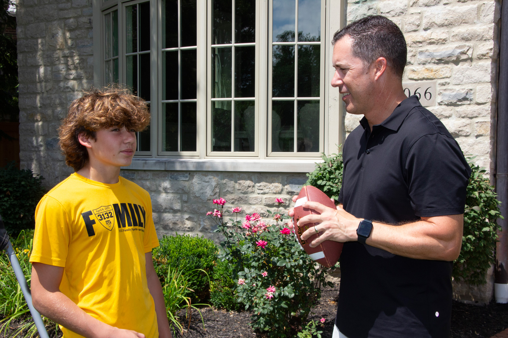 Todd Walter playing football with son